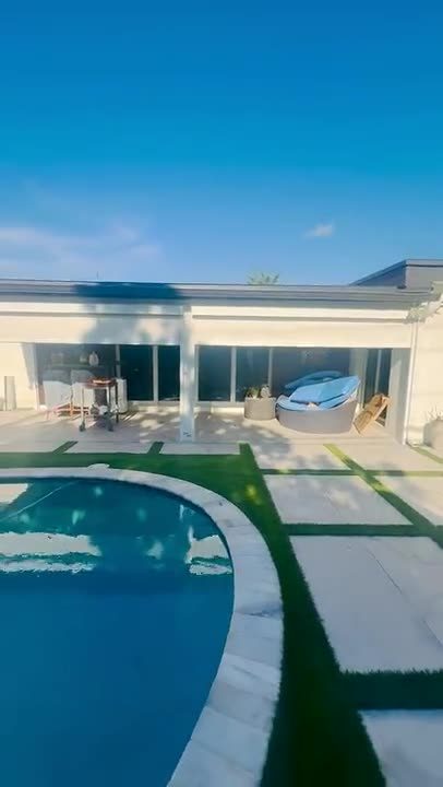 Ivory screens coming down beside the pool